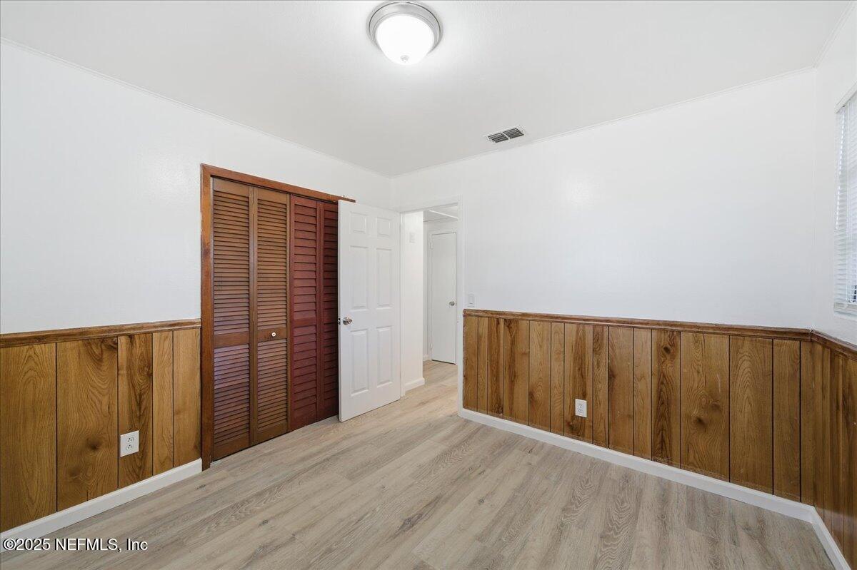 2142 Fouraker Road Jacksonville, FL 32210 - Photo 23 of 29 wooden floor in an empty room