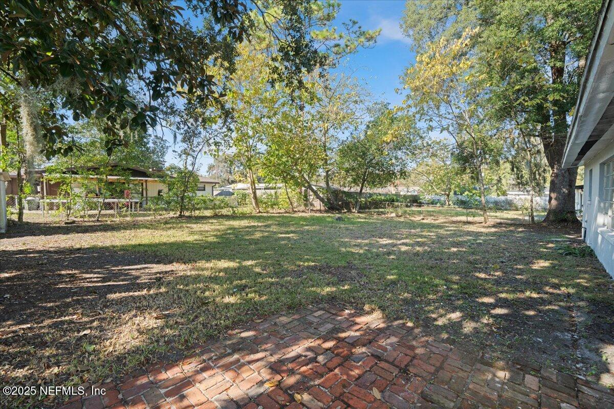 2142 Fouraker Road Jacksonville, FL 32210 - Photo 29 of 29 a view of a field with trees