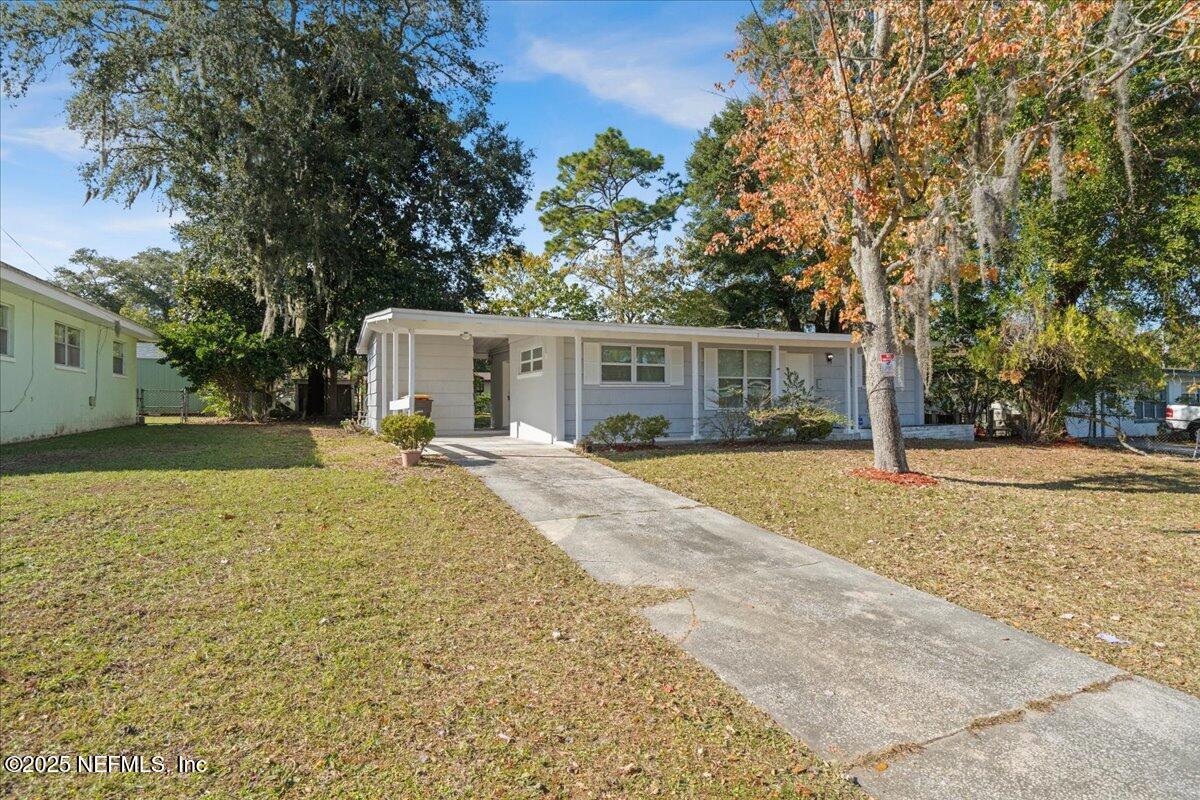 2142 Fouraker Road Jacksonville, FL 32210 - Photo 3 of 29 a view of house with yard