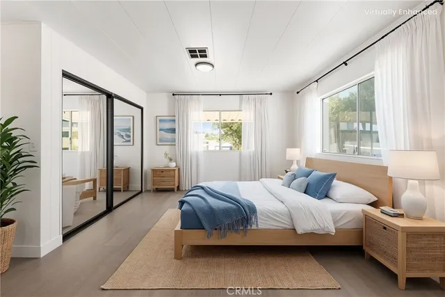 a bedroom with a bed and a couch