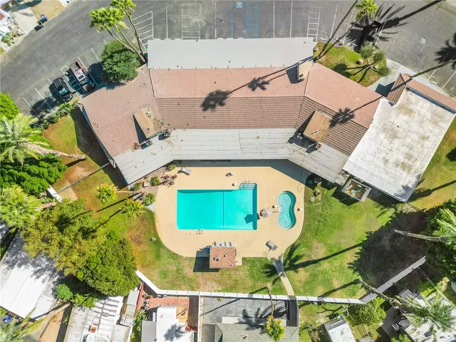 an aerial view of a house with a swimming pool