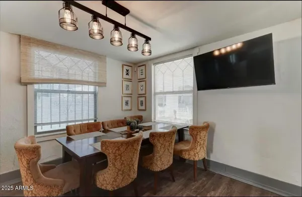 a view of a dining room with furniture and window