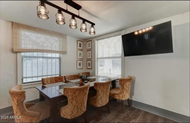 a view of a dining room with furniture and window