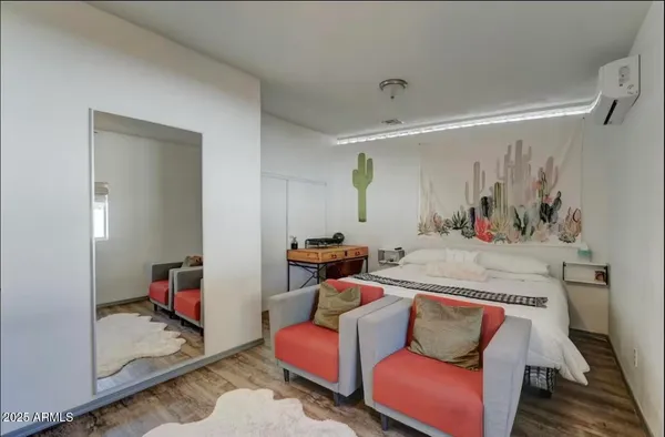 a living room with furniture and a mirror