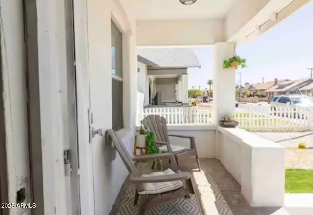 a dining room with furniture and a window
