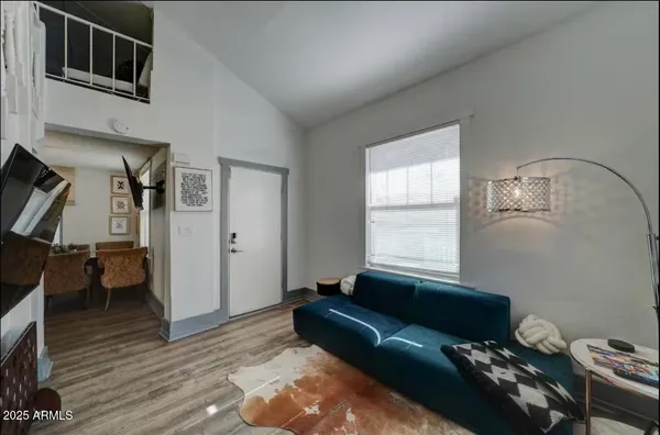 a living room with furniture and a window