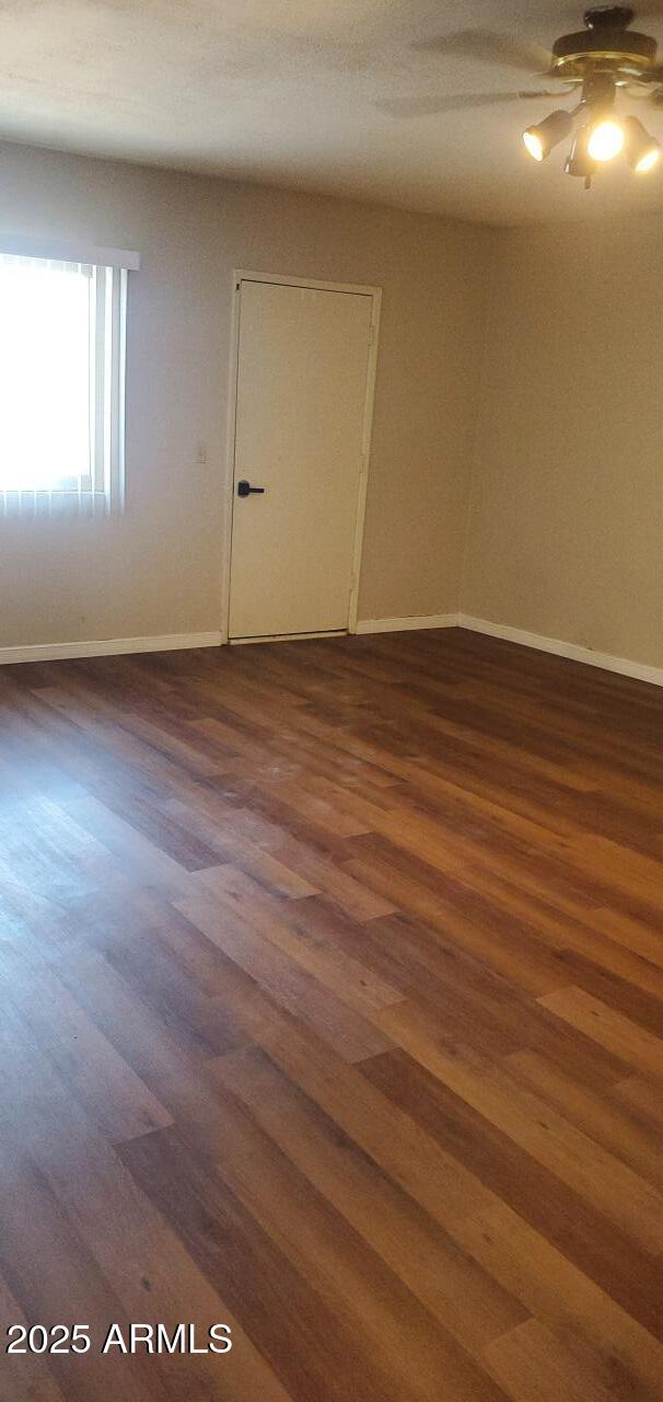 824 West Fordham Drive Tempe, AZ 85283 - Photo 18 of 20 an empty room with wooden floor and windows