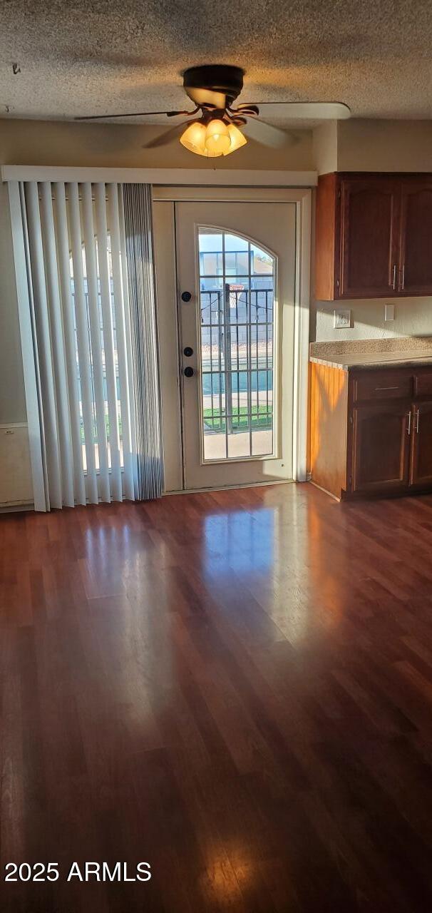 824 West Fordham Drive Tempe, AZ 85283 - Photo 4 of 20 a view of an empty room with wooden floor and a window