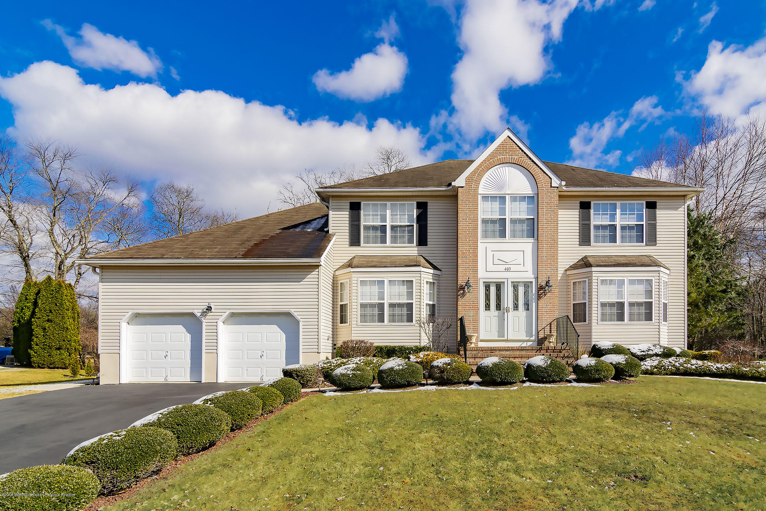 403 Meadowood Road Jackson, NJ 08527 - Photo 1 of 46 a front view of a house with a yard
