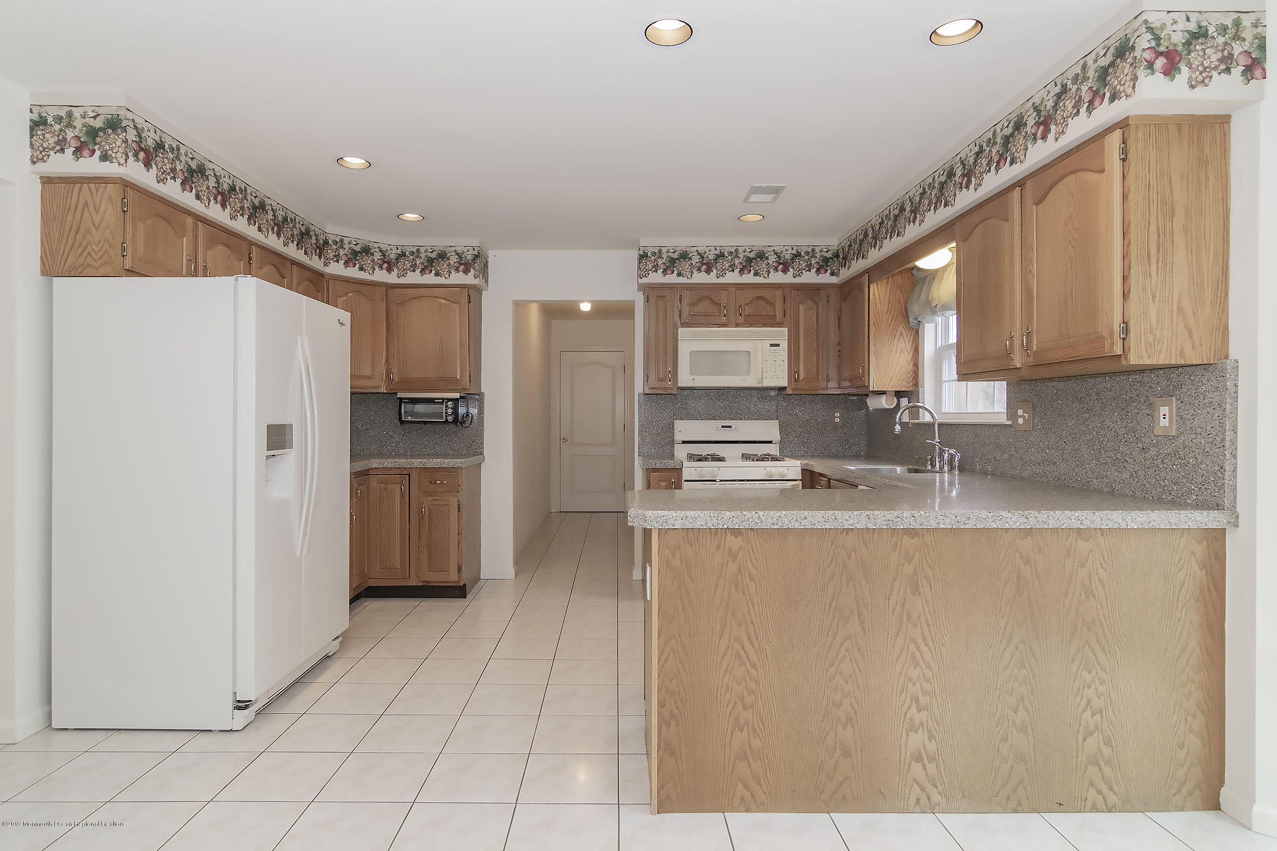 403 Meadowood Road Jackson, NJ 08527 - Photo 12 of 46 a kitchen with stainless steel appliances granite countertop a refrigerator a sink and a stove