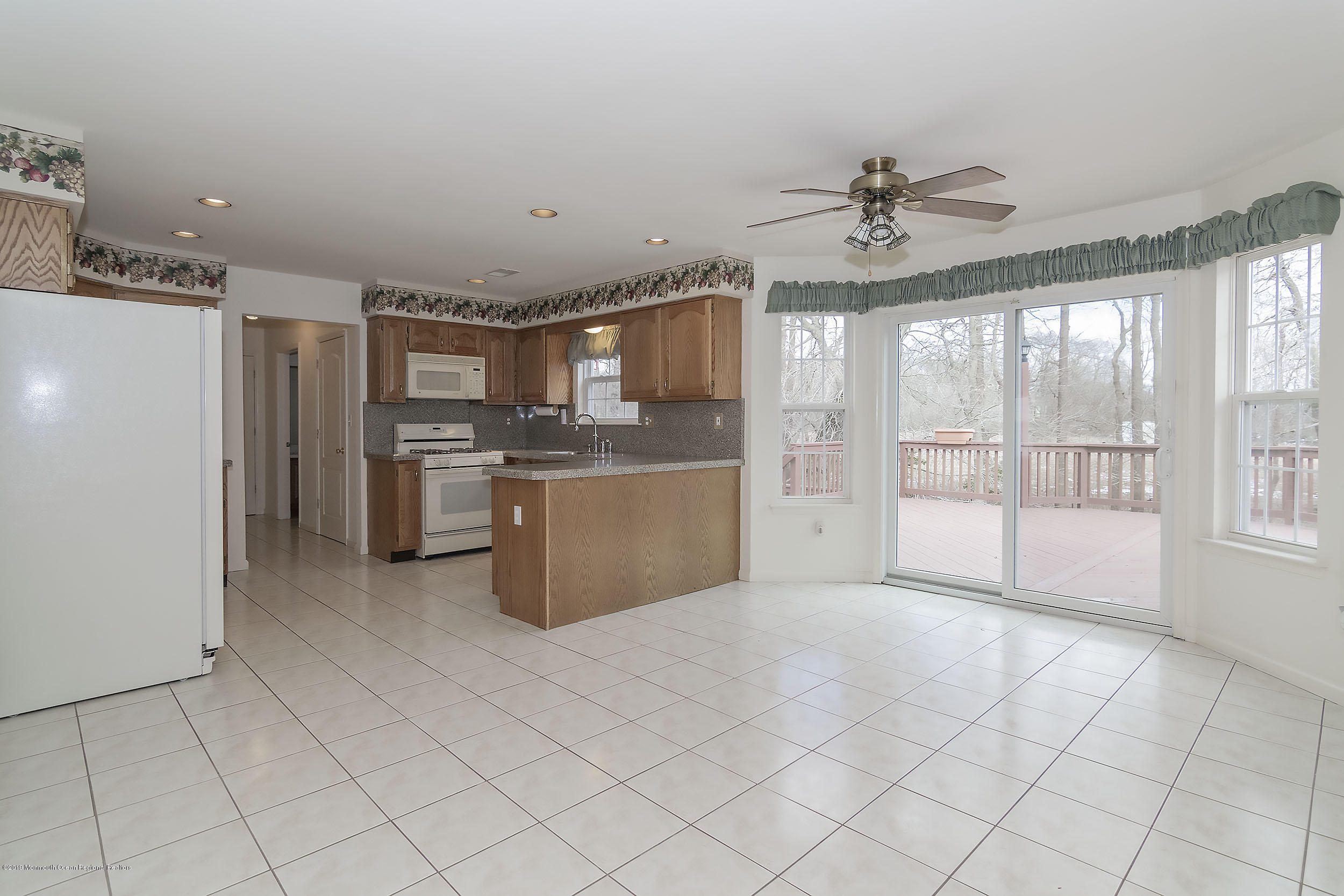 403 Meadowood Road Jackson, NJ 08527 - Photo 14 of 46 a large kitchen with cabinets and stainless steel appliances