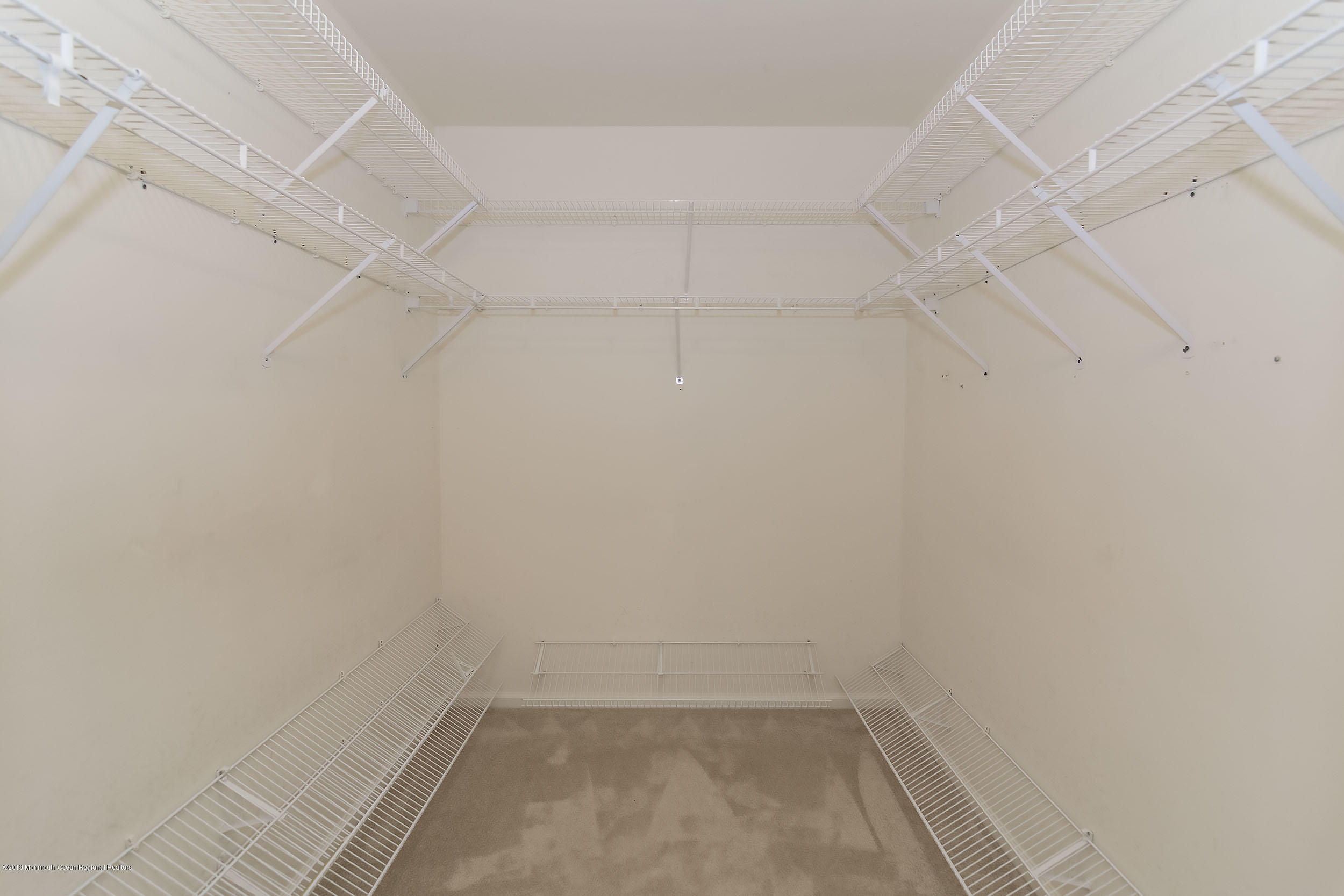 403 Meadowood Road Jackson, NJ 08527 - Photo 29 of 46 a view of a room with racks on the wall