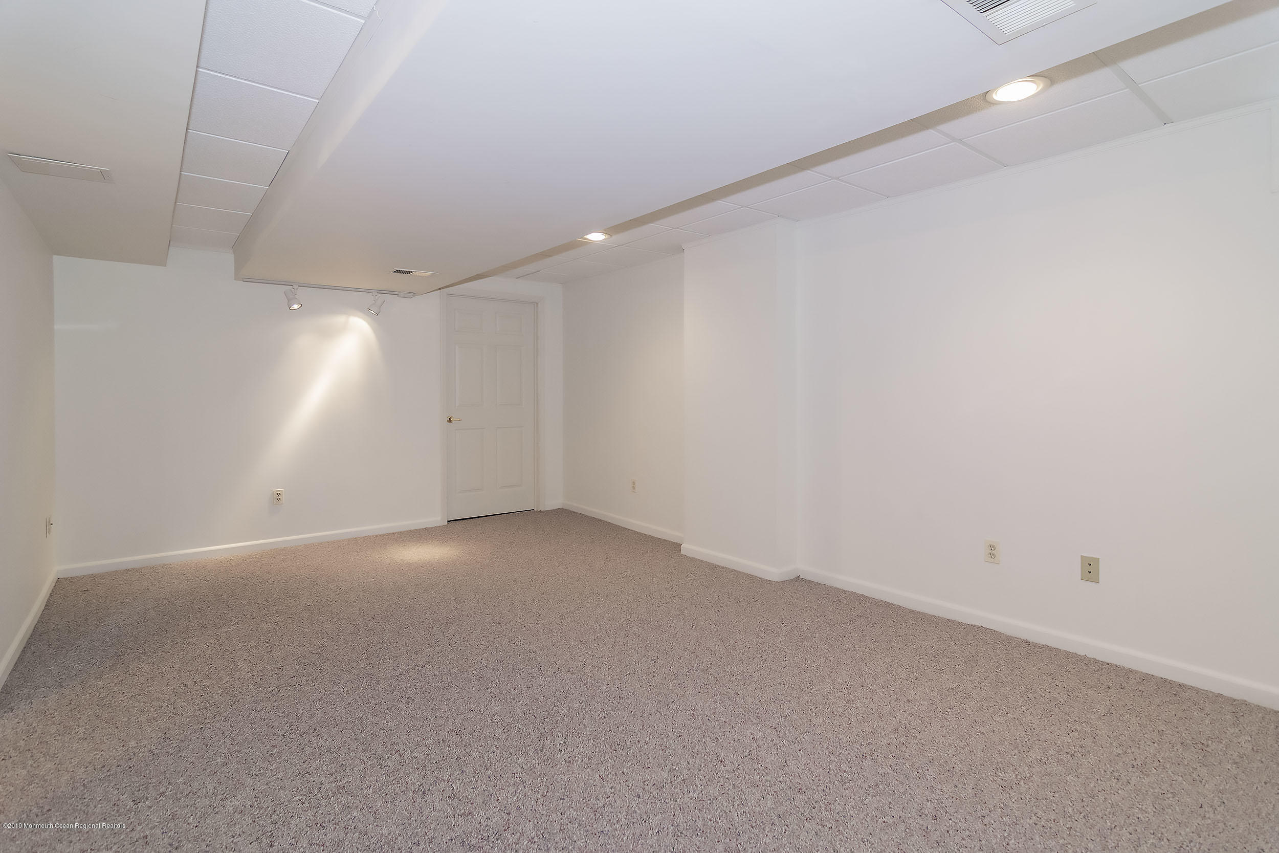 403 Meadowood Road Jackson, NJ 08527 - Photo 30 of 46 an empty room with a empty space and windows