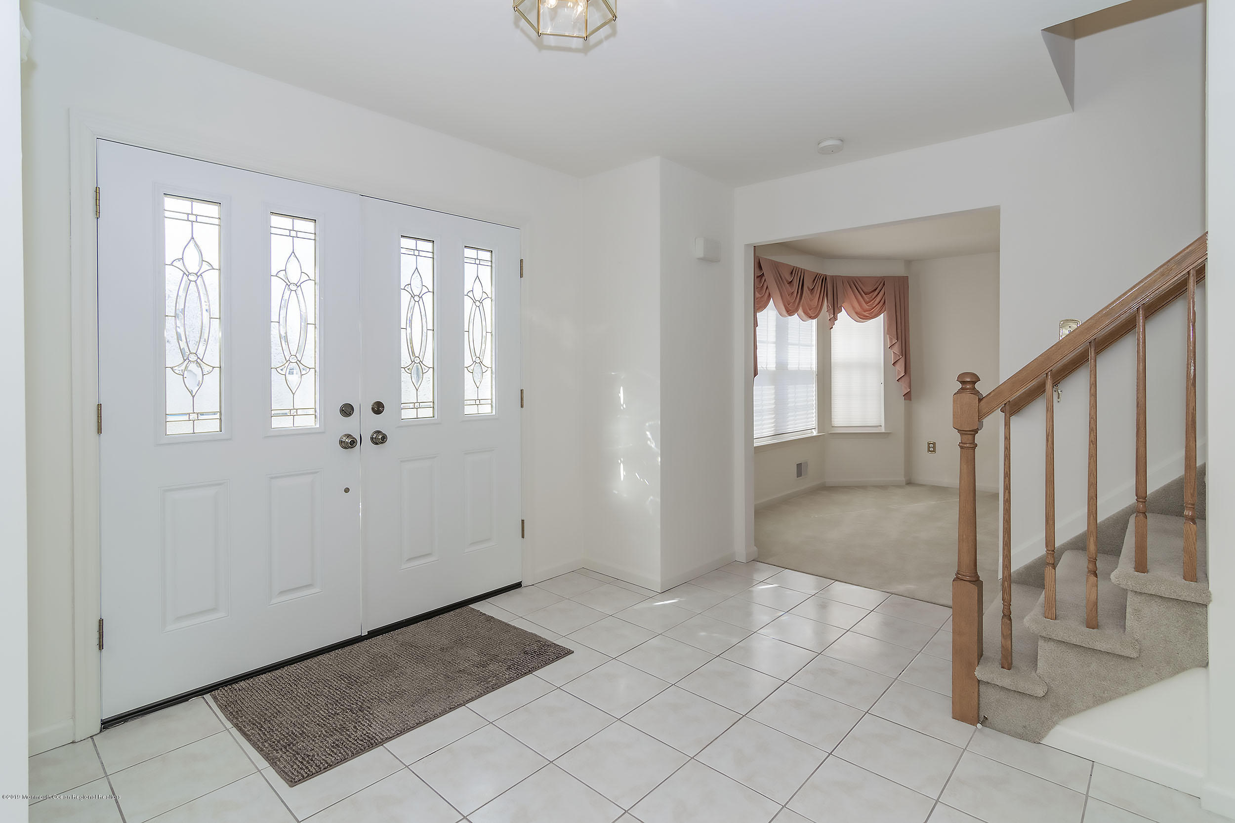 403 Meadowood Road Jackson, NJ 08527 - Photo 4 of 46 a view of an entryway with wooden floor