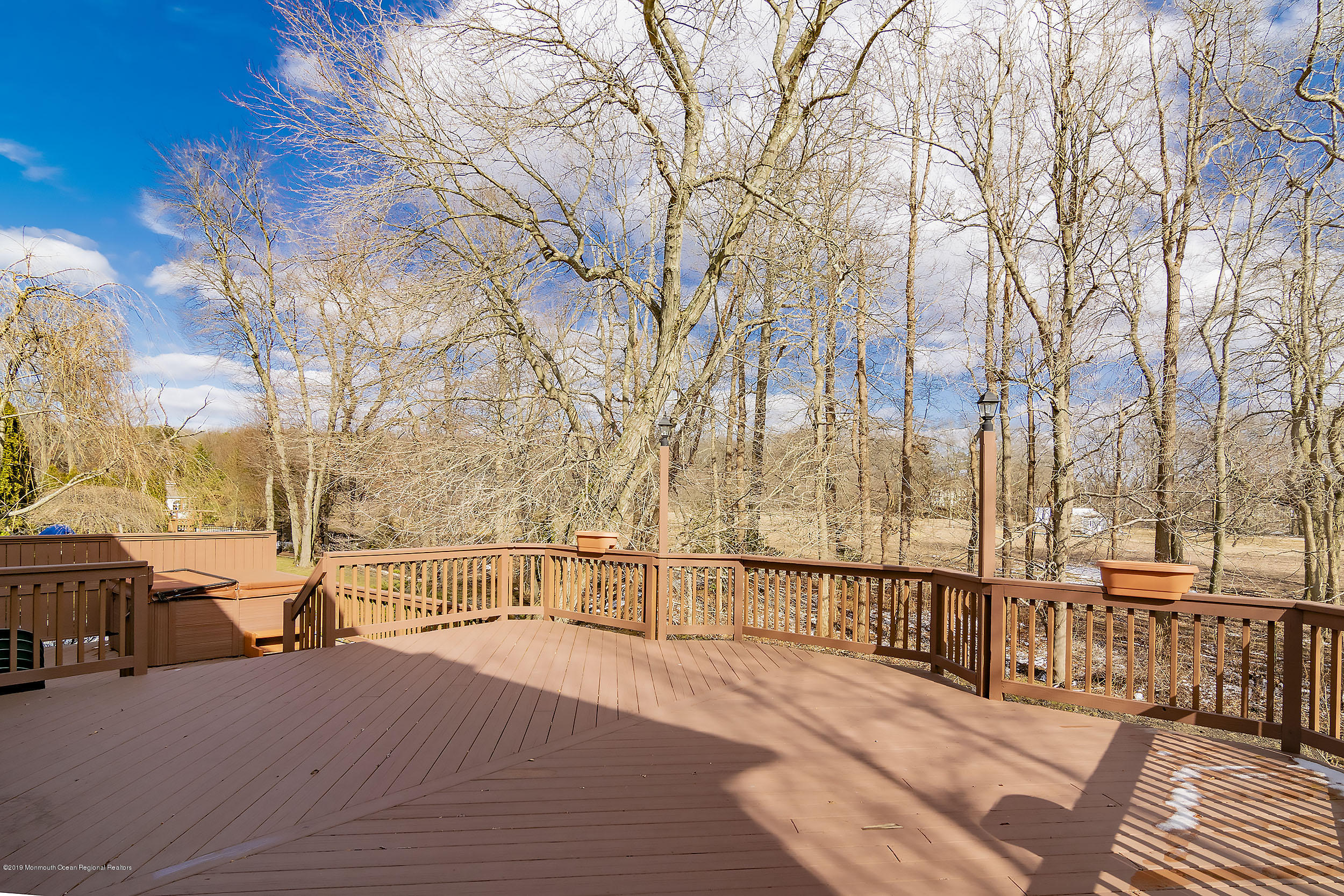 403 Meadowood Road Jackson, NJ 08527 - Photo 35 of 46 a view of outdoor space with deck and trees