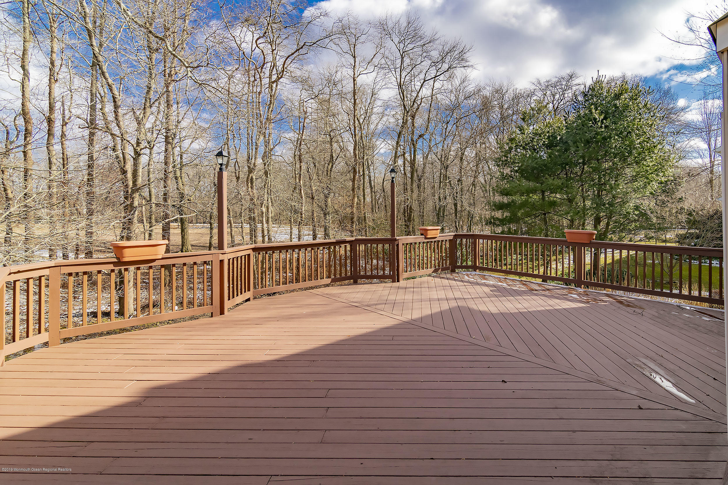 403 Meadowood Road Jackson, NJ 08527 - Photo 36 of 46 a view of a balcony with wooden floor