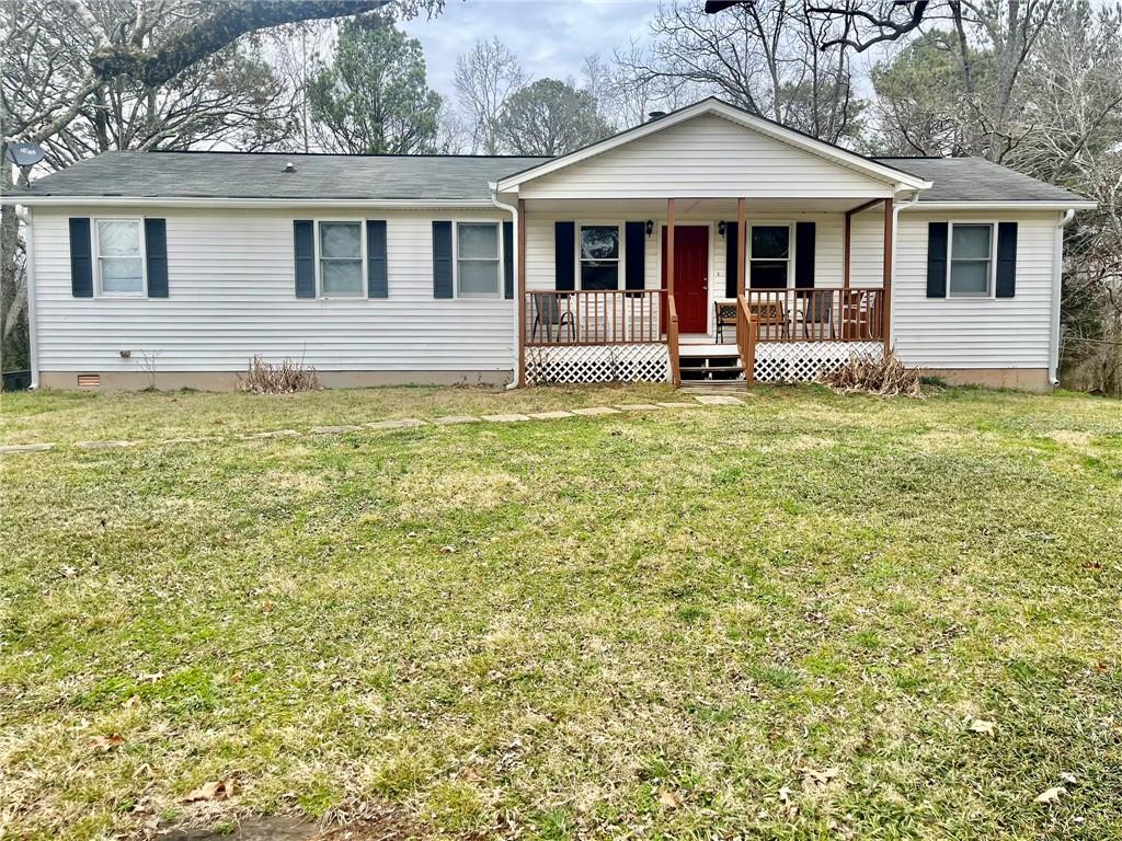 7268 Berea Road Winston, GA 30187 - Photo 1 of 1 a front view of a house with garden