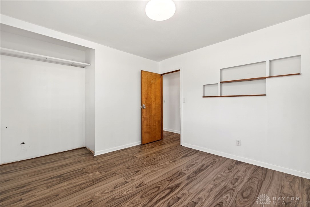 1005 Free Road New Carlisle, OH 45344 - Photo 26 of 43 This bright room features durable flooring and built-in shelving, ready for your personal touch.