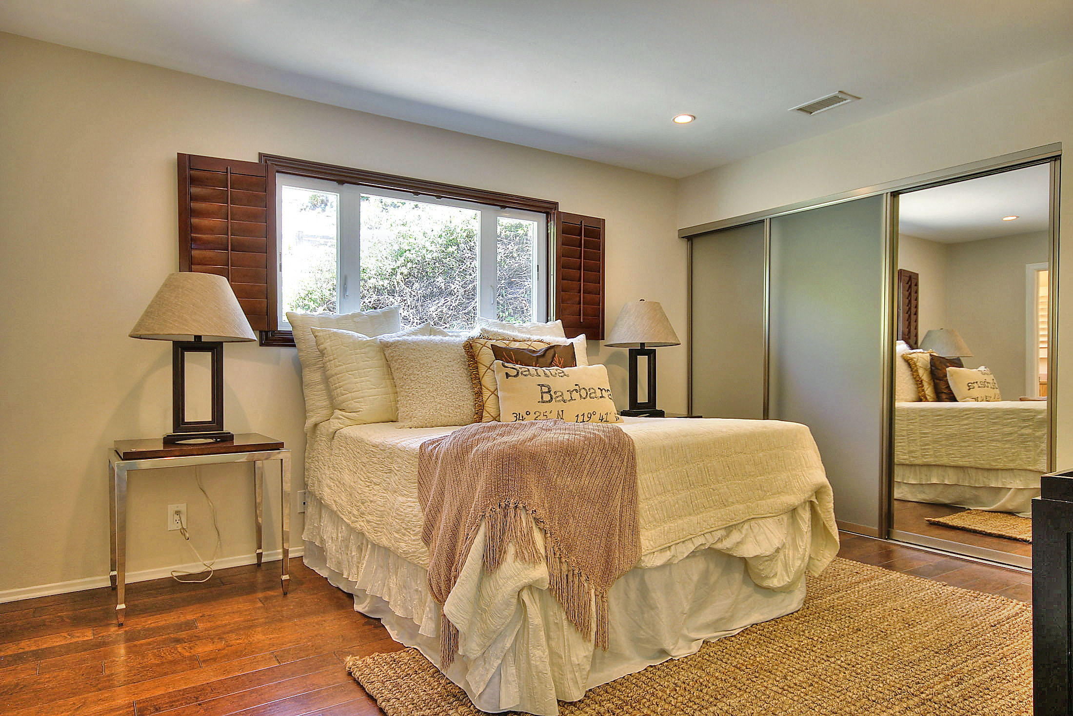 515 Fellowship Road Santa Barbara, CA 93109 - Photo 16 of 25 a bedroom with a bed and a lamp on table