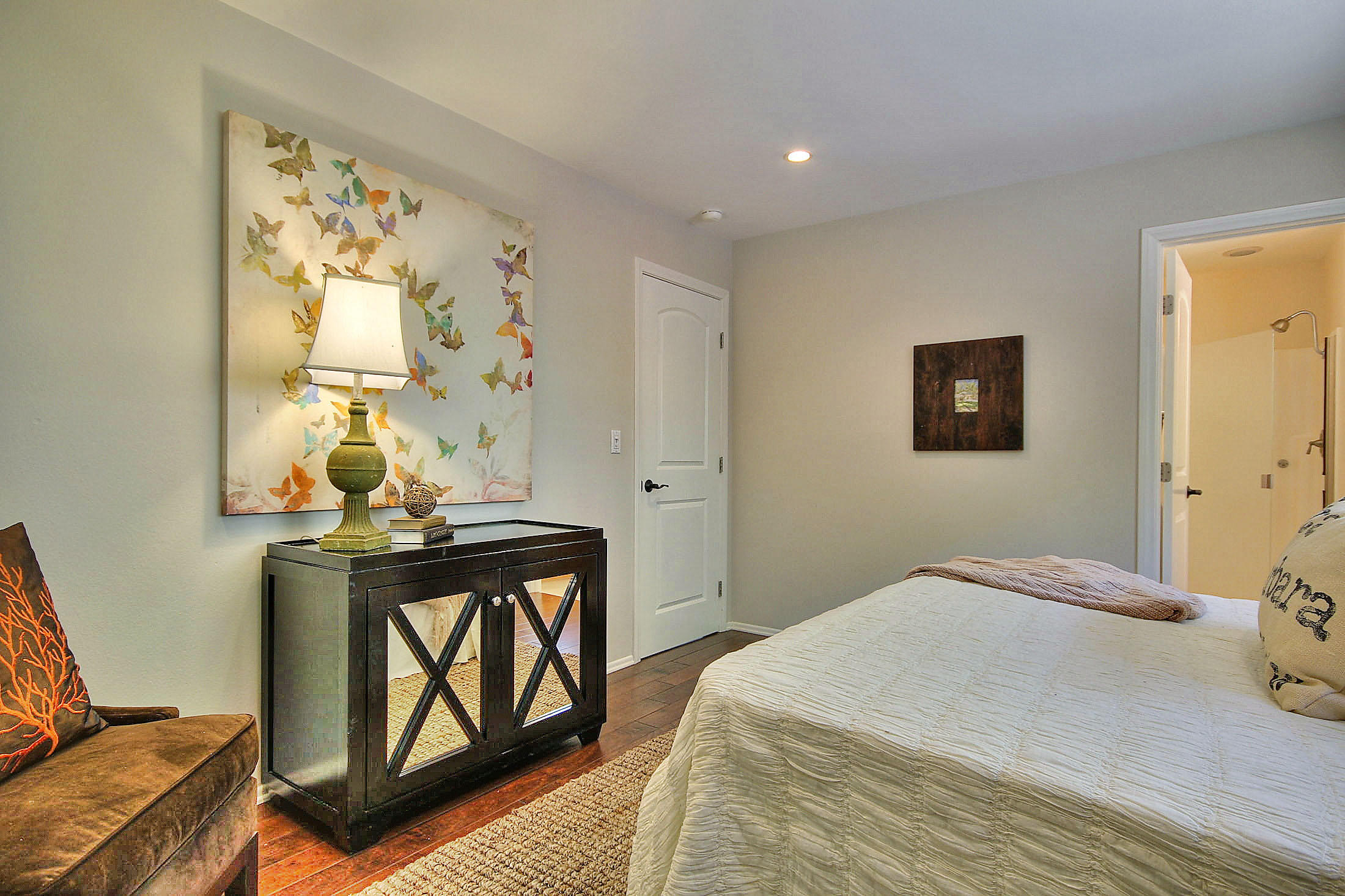 515 Fellowship Road Santa Barbara, CA 93109 - Photo 17 of 25 a bedroom with a bed and wooden floor