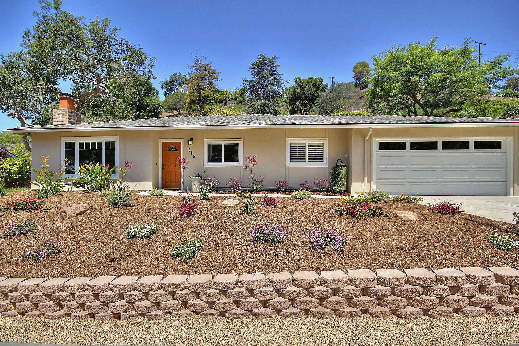 515 Fellowship Road Santa Barbara, CA 93109 - Photo 2 of 25 a backyard of a house with wooden fence and large trees