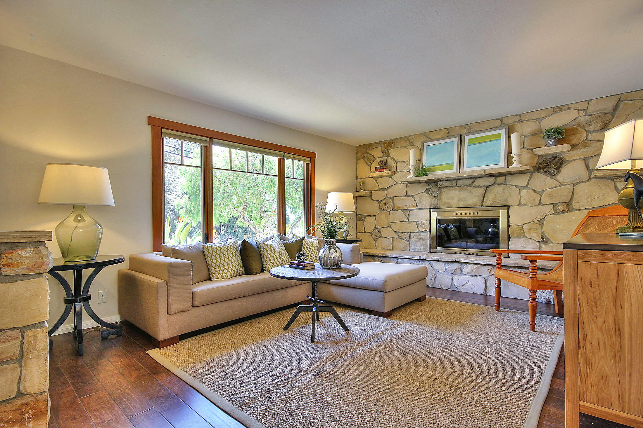 515 Fellowship Road Santa Barbara, CA 93109 - Photo 5 of 25 a living room with furniture and a fireplace