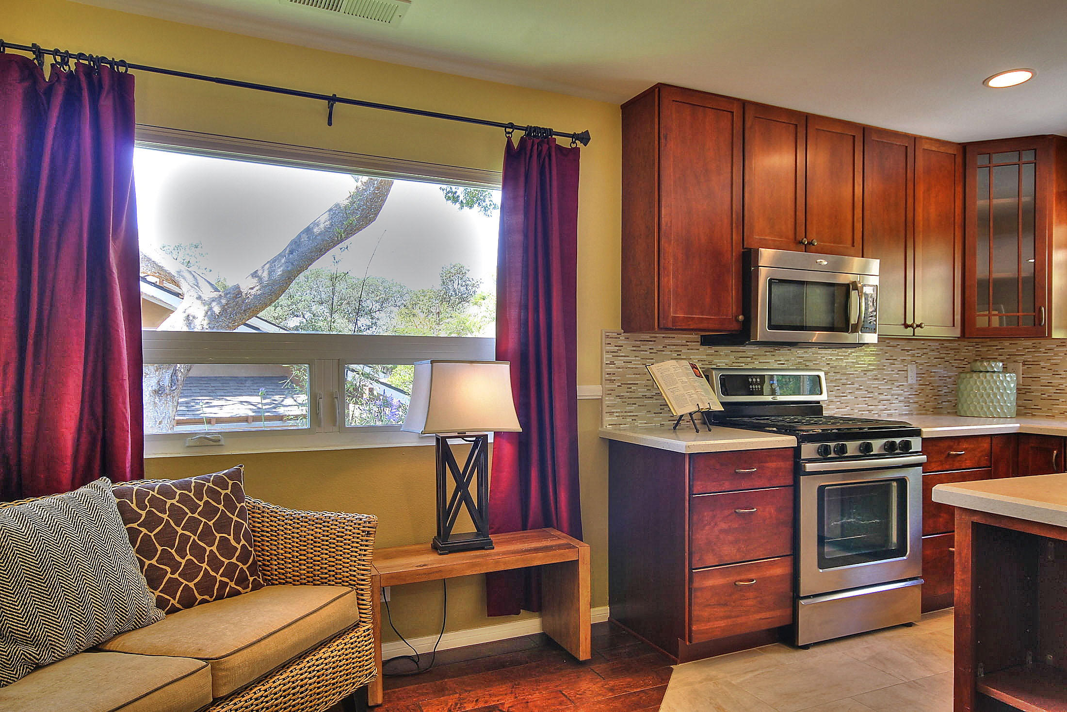 515 Fellowship Road Santa Barbara, CA 93109 - Photo 7 of 25 a living room with stainless steel appliances wooden floors and a large window