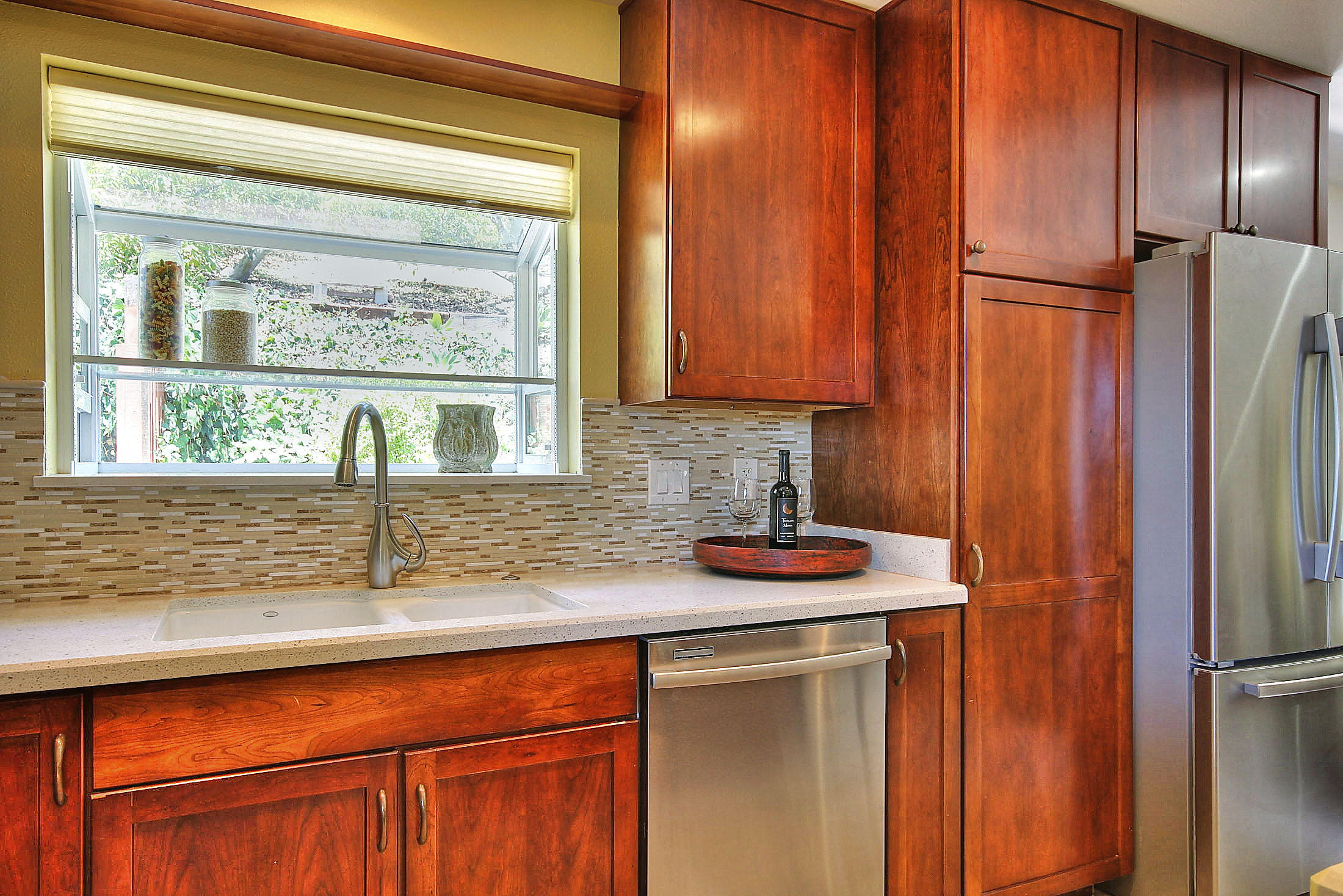 515 Fellowship Road Santa Barbara, CA 93109 - Photo 9 of 25 a kitchen with stainless steel appliances granite countertop cabinets and window