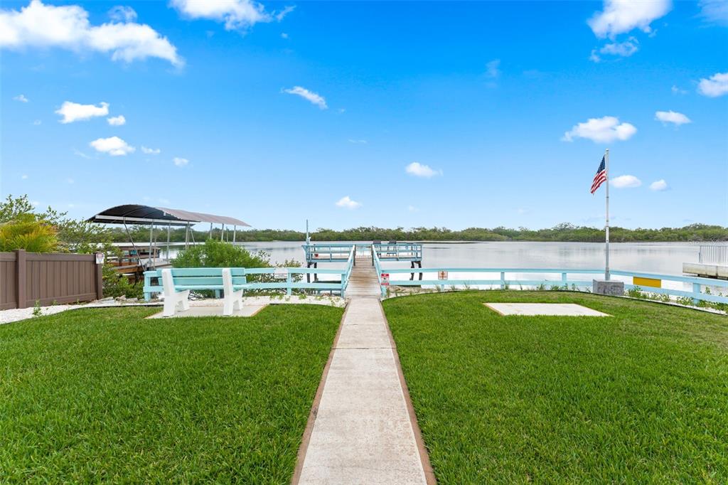 29 Pelican Lane Edgewater, FL 32141 - Photo 39 of 39 a view of a lake with a garden and trees