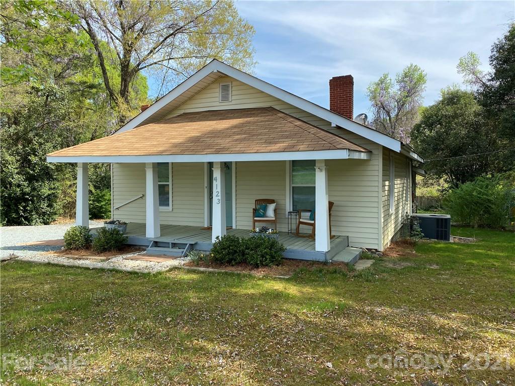 4123 Old Monroe Road Indian Trail, NC 28079 - Photo 3 of 14 a front view of a house with garden