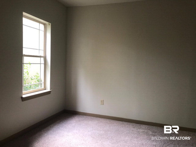 1430 Regency Road, Unit B101 Gulf Shores, AL 36542 - Photo 5 of 11 Master bedroom