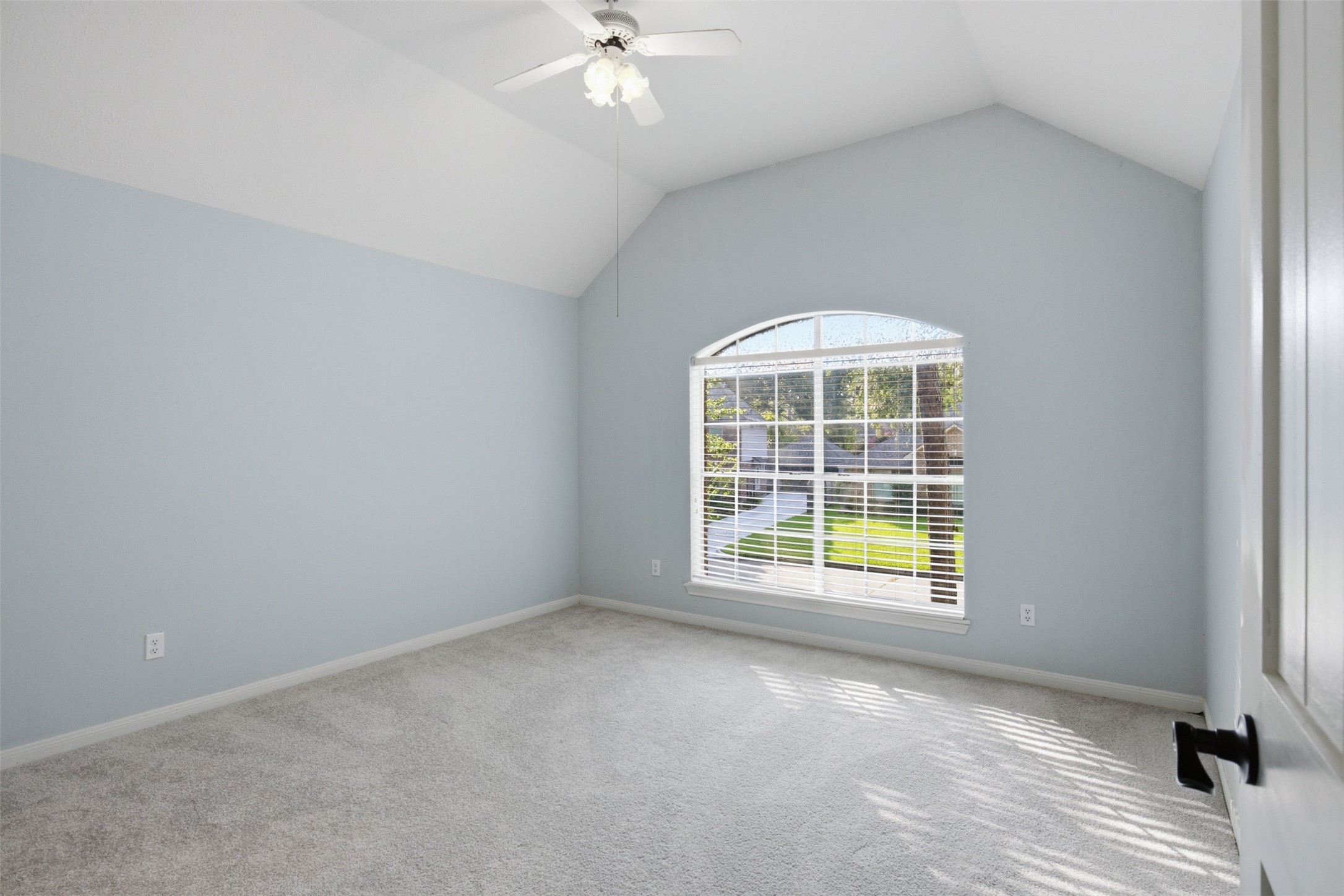 323 Magic Oaks Court Spring, TX 77388 - Photo 40 of 49 The large window and vaulted ceiling make this second upstairs bedroom unique and easy to style.