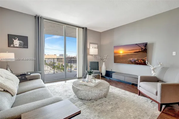 a living room with furniture and a flat screen tv