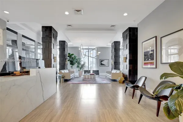 a living room with furniture and a large window
