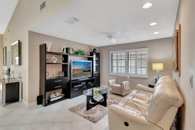 a bedroom with two beds and a large window