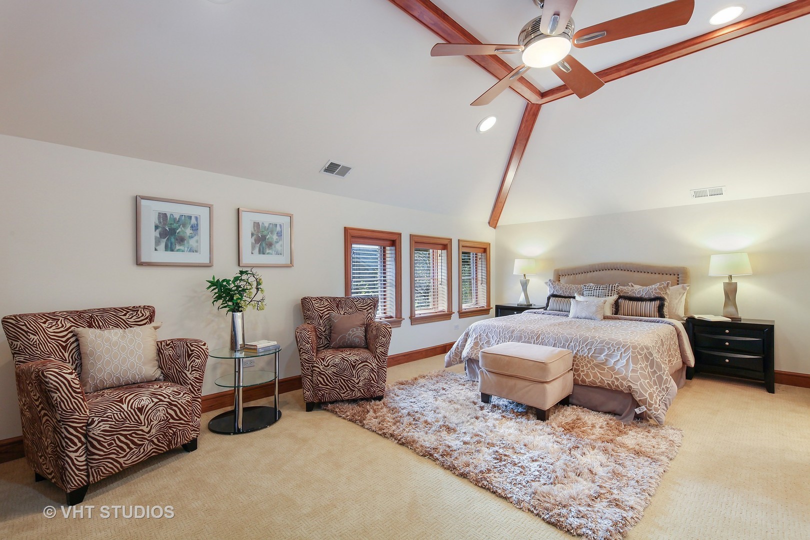697 Rienzi Lane Highwood, IL 60040 - Photo 12 of 24 a spacious bedroom with a bed a couch and a window