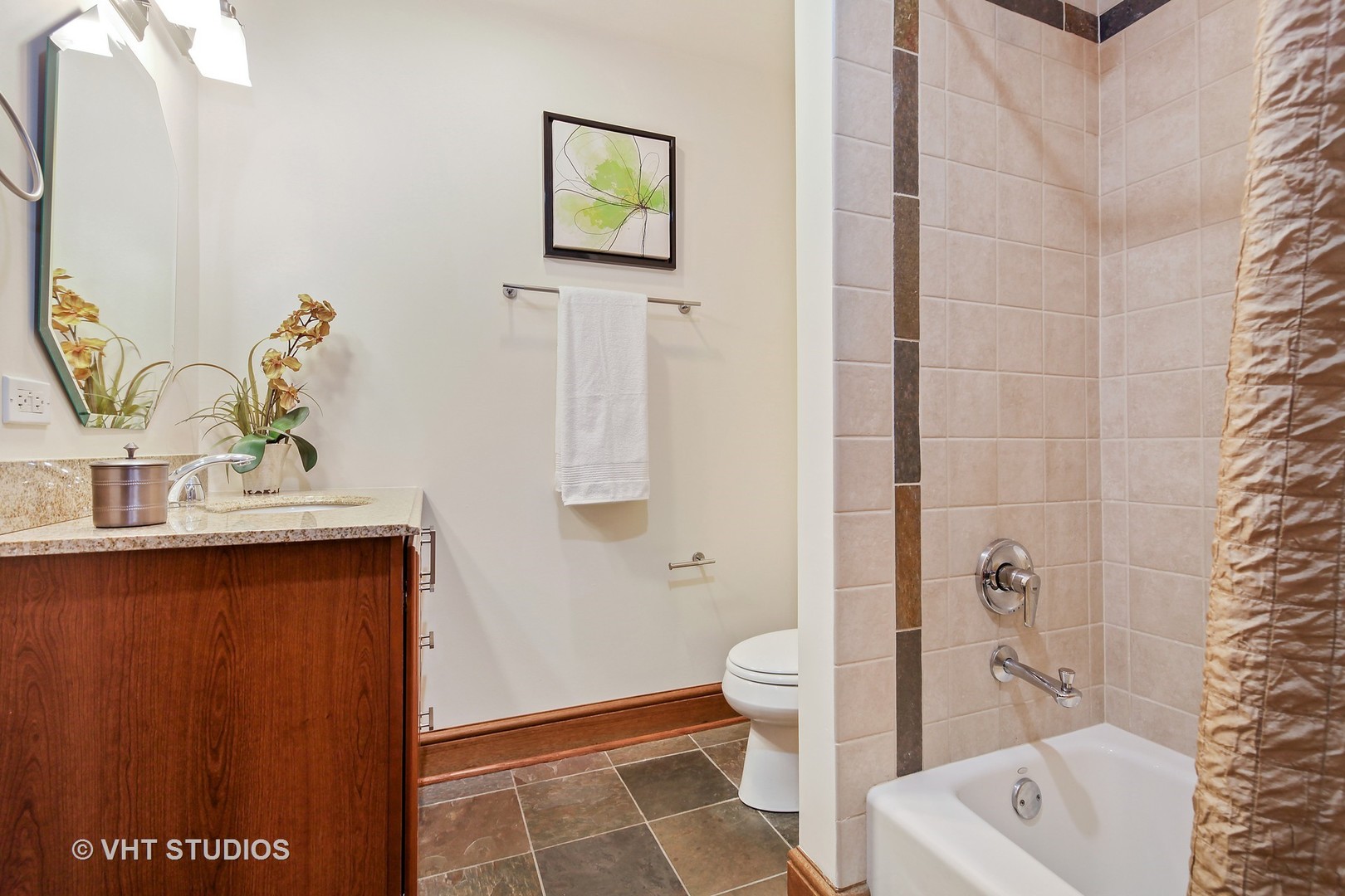 697 Rienzi Lane Highwood, IL 60040 - Photo 17 of 24 a bathroom with a sink a toilet and shower curtain