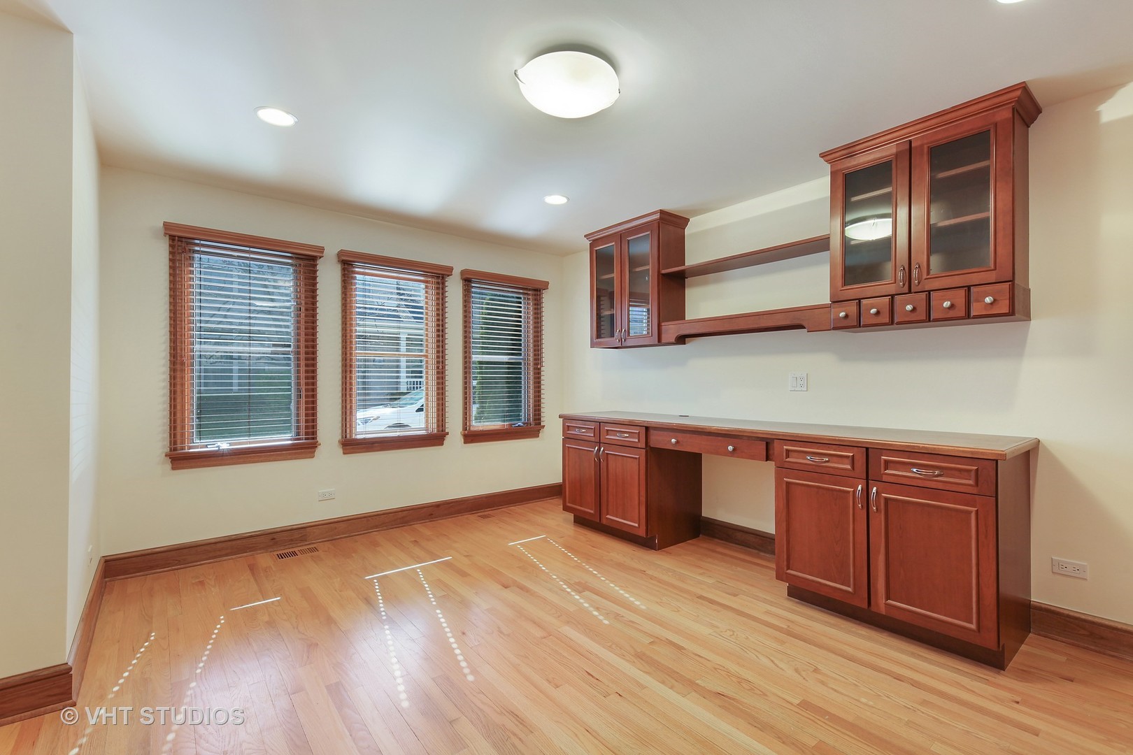 697 Rienzi Lane Highwood, IL 60040 - Photo 19 of 24 a room with wooden floors and wooden cabinets