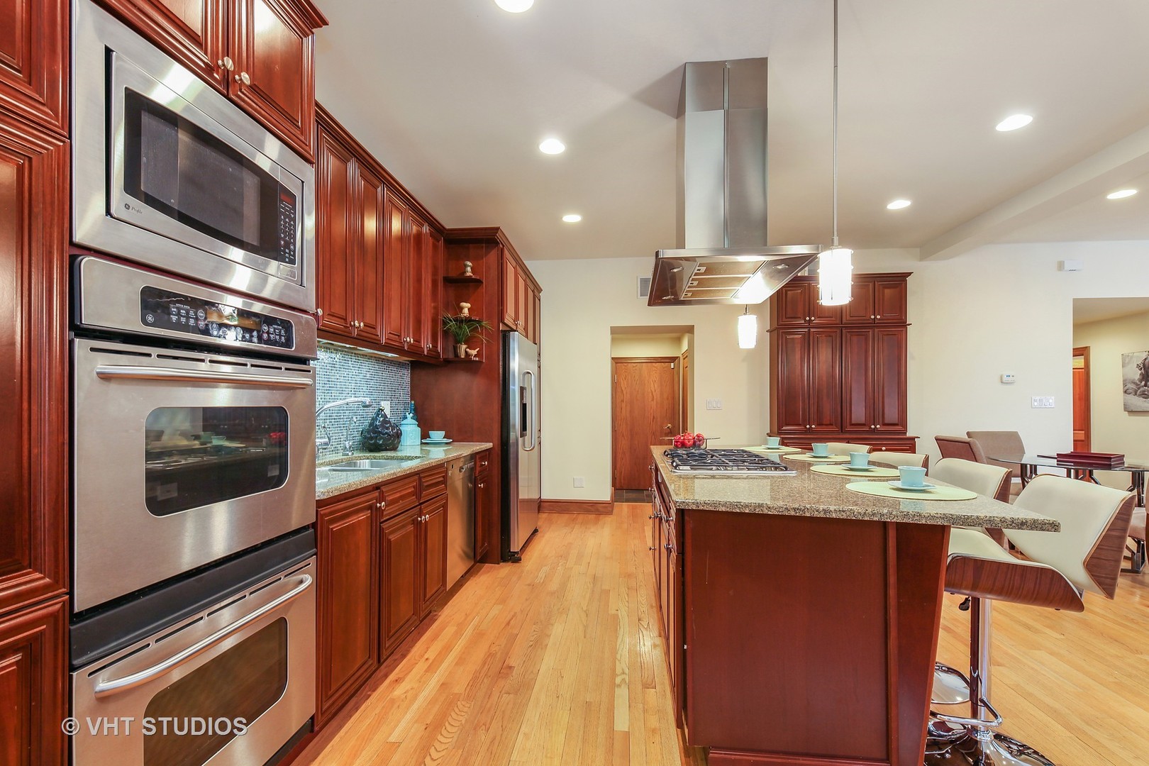 697 Rienzi Lane Highwood, IL 60040 - Photo 5 of 24 a kitchen with stainless steel appliances granite countertop a stove and cabinets