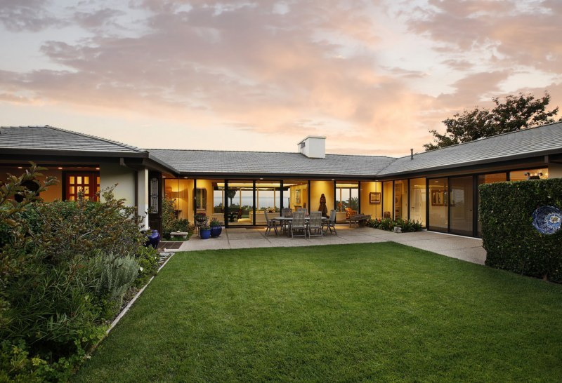 swimming pool view with a garden space