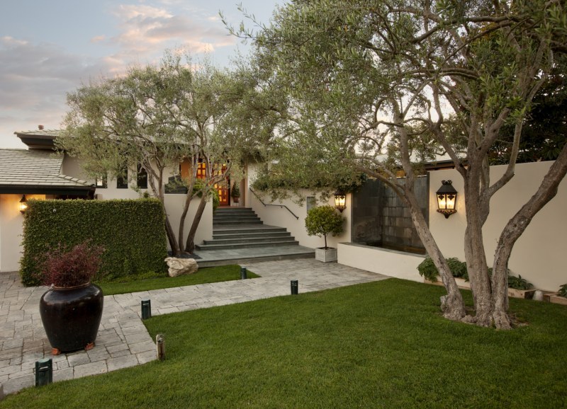 447 Lanai Road Santa Barbara, CA 93108 - Photo 2 of 10 a view of a backyard with table and chairs potted plants and large tree