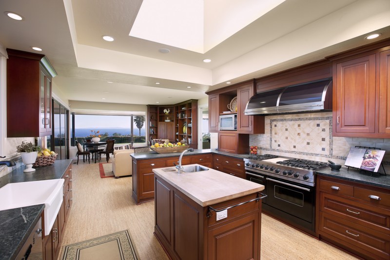 447 Lanai Road Santa Barbara, CA 93108 - Photo 4 of 10 a kitchen with a stove a refrigerator and chairs