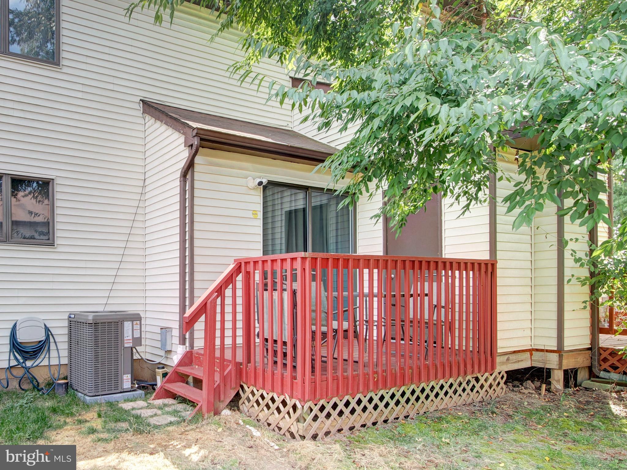 8 Beckett Court Ewing, NJ 08628 - Photo 17 of 20 a view of a house with a backyard and a tree