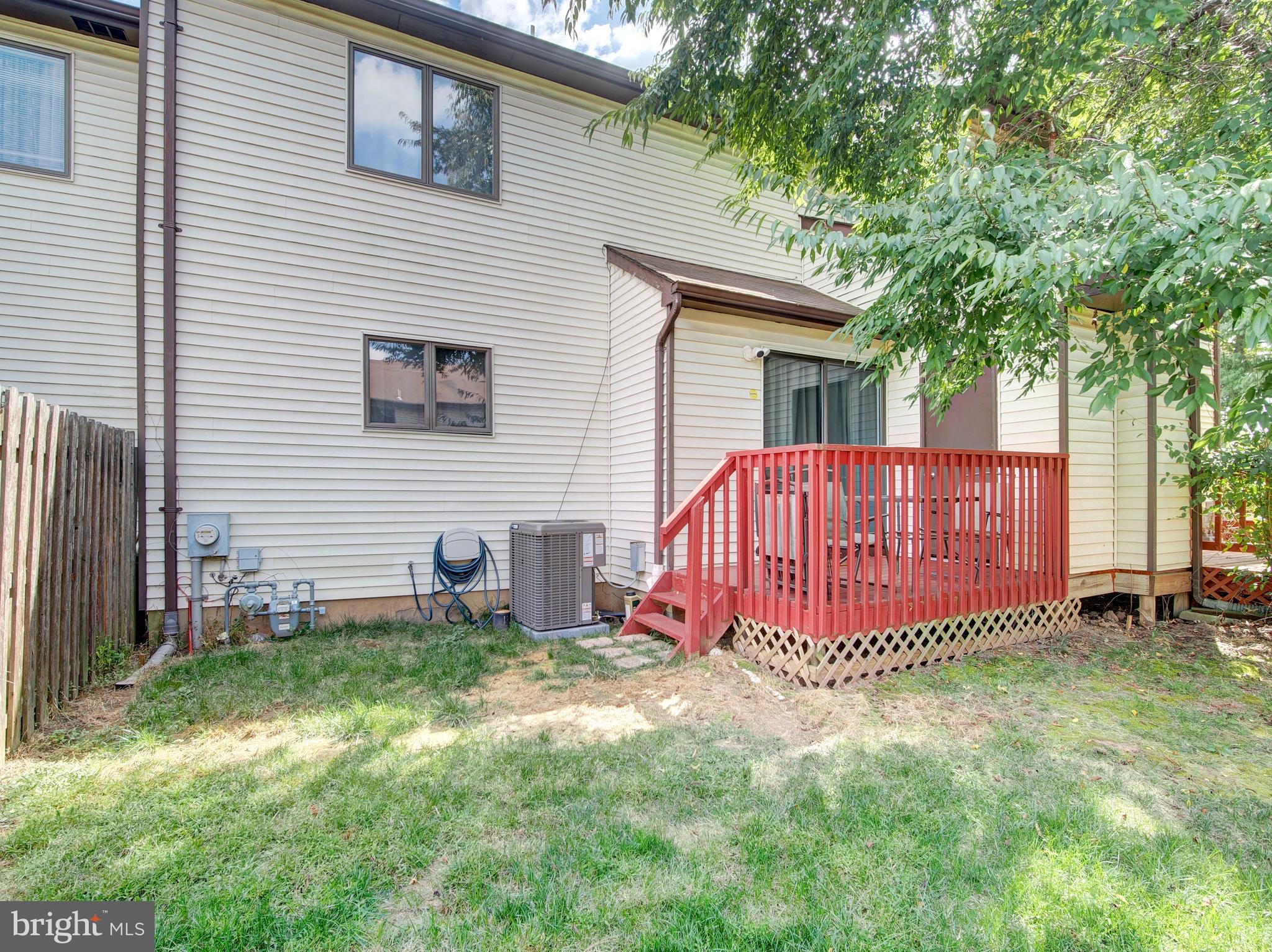 8 Beckett Court Ewing, NJ 08628 - Photo 20 of 20 a view of a house with a yard and deck