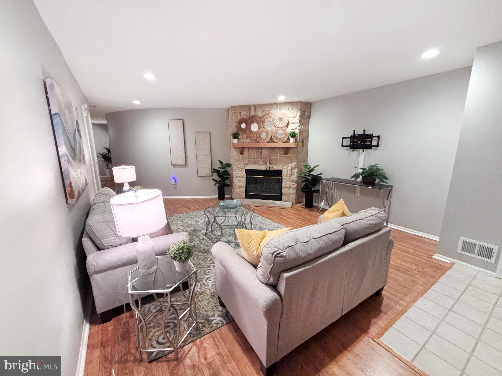 8 Beckett Court Ewing, NJ 08628 - Photo 3 of 20 a living room with furniture and a fireplace