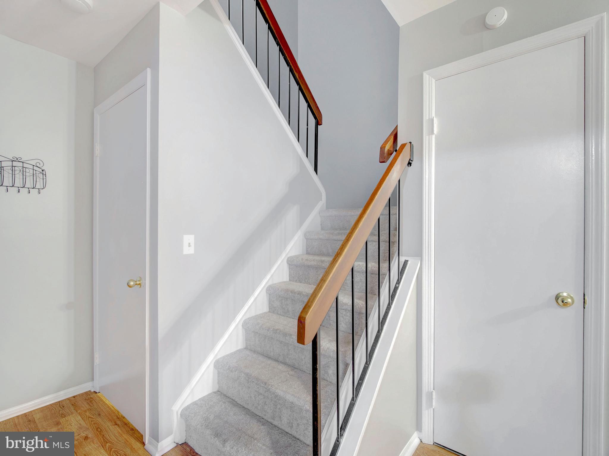 8 Beckett Court Ewing, NJ 08628 - Photo 7 of 20 a view of a hallway with wooden floor and entryway
