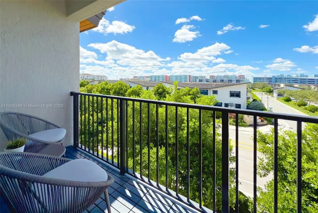 a view of a balcony with furniture