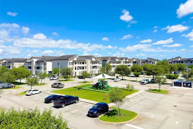 a view of a swimming pool with outdoor seating