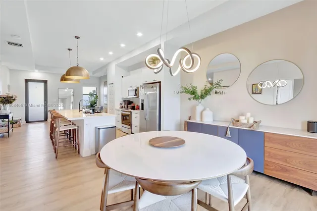 a view of kitchen and dining area with furniture