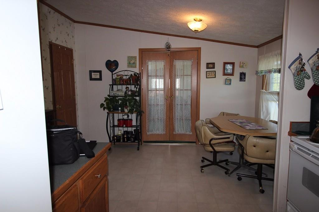 27 Beans Mill Road Corinth, ME 04427 - Photo 15 of 35 Kitchen and dining area are...